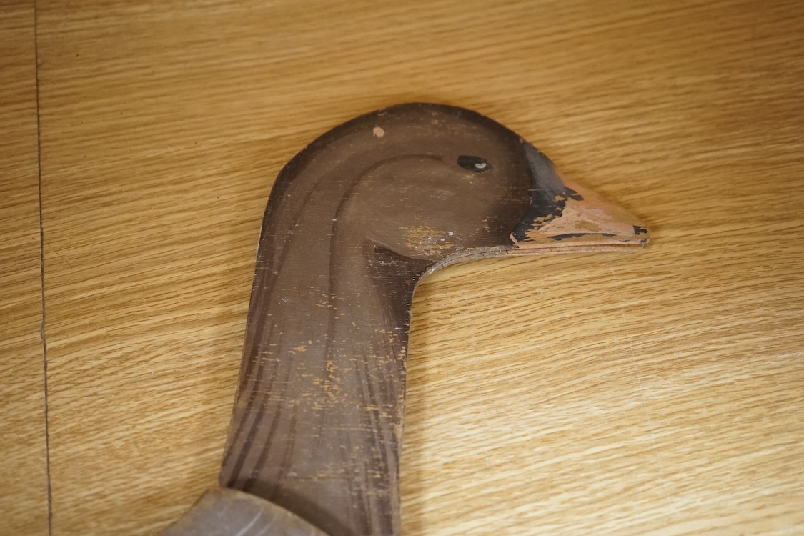 A pair of painted ply 'goose' profile decoys, 58cm high